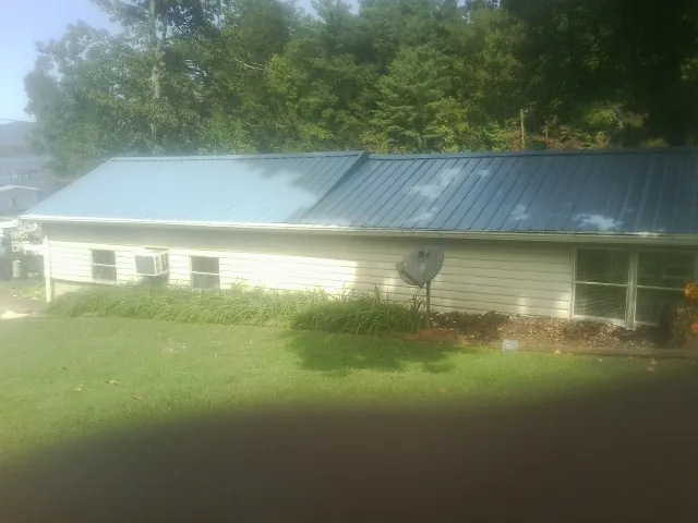 Blue metal roof running the length of a single story home in Carefree